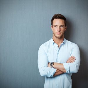man standing with arms crossed